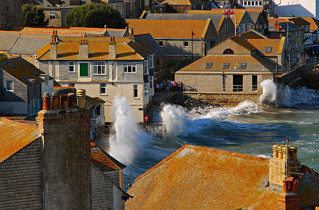 High waves crashing into the sea wall in St. Ives, Cornwall, England