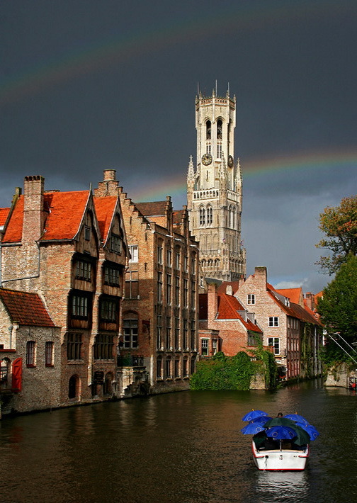 Rainbows above the belfry in Bruges, Belgium